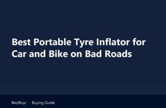 Portable tyre inflator for car and bike topping up a scooter tyre on a wet street beside a pothole
